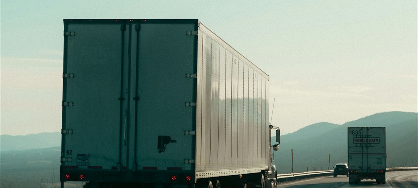 Line of commercial trucks ready for the next load — track detention with GetDockPay